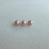 A set of three round pearls not drilled PP34X3