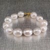 Bracelet made of real pearls of white baroque with a gold-plated clasp PBS39