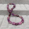 A set of purple rectangular agates with earrings on a decorative stick KZ21